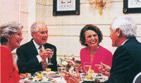 Residents Gathered Around Dinner Table